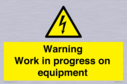 warning-work-in-progress-on-equipmentwith-electrical-hazard-symbol~